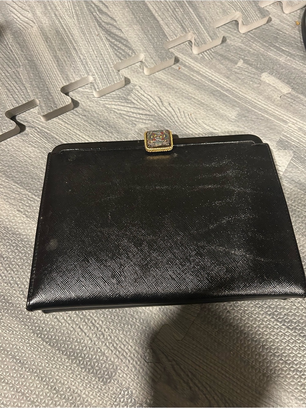 Elegant Black Evening Clutch with Decorative Gold Accent